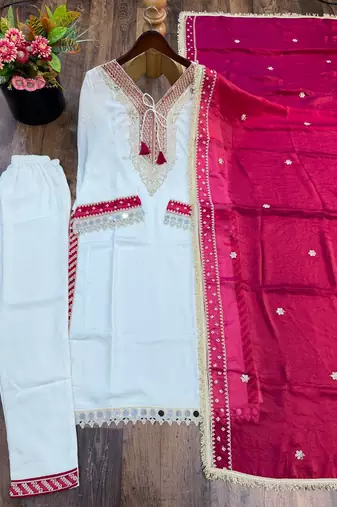 White heavy embroidered kurti pant set with contrast rani pink silk dupatta