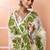 Off white festive wear cotton silk green border pallu jamdani saree with running blouse