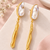 Certified natural freshwater pearls jewellery baroque pearl drop earrings with gold-toned wavy bar pendant