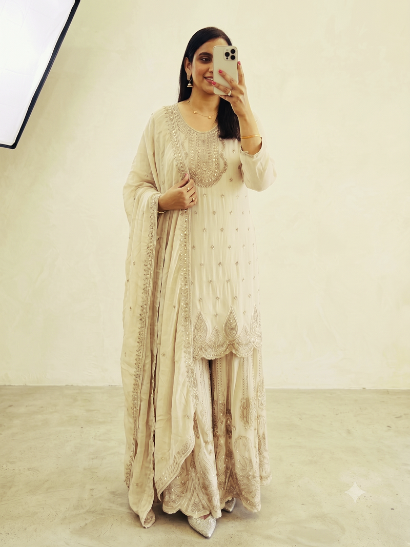 White heavy zari work short kurti with flared sharara & dupatta