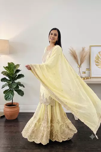 Yellow heavy zari work short kurti with flared sharara & dupatta