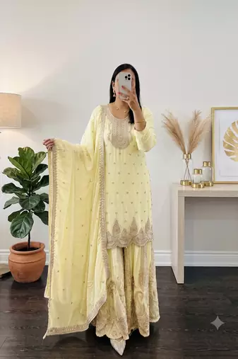 Yellow heavy zari work short kurti with flared sharara & dupatta