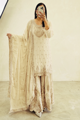 White heavy zari work short kurti with flared sharara & dupatta