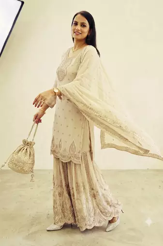 White heavy zari work short kurti with flared sharara & dupatta