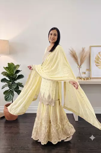 Yellow heavy zari work short kurti with flared sharara & dupatta