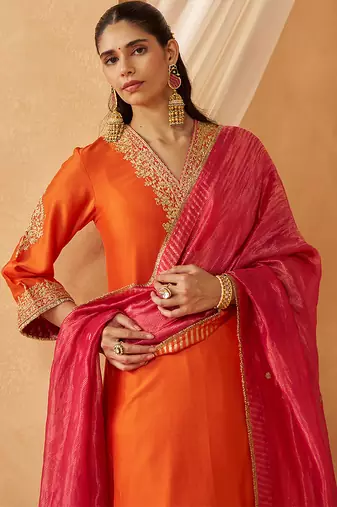 Burnt orange chauga with salwar and dupatta