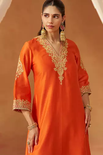 Burnt orange chauga with salwar and dupatta