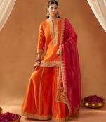 Burnt orange kurta with sharara and dupatta