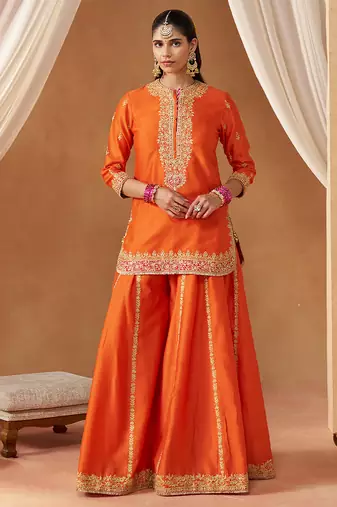 Burnt orange kurta with sharara and dupatta
