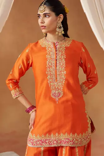 Burnt orange kurta with sharara and dupatta
