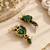 Gold oxidised traditional green drop earrings