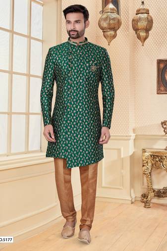 Green heavy jacquard sherwani set with full zari embroidery, minimal detailing, and fancy buttons.