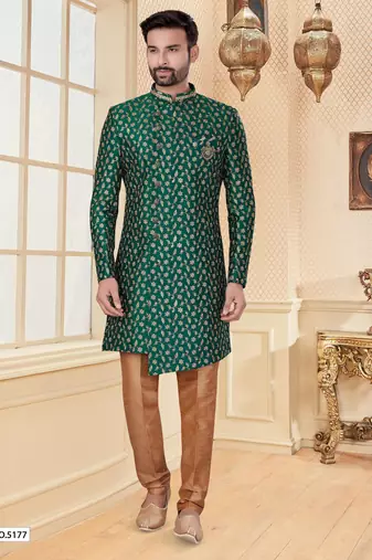 Green heavy jacquard sherwani set with full zari embroidery, minimal detailing, and fancy buttons.