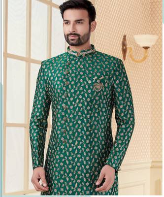 Green heavy jacquard sherwani set with full zari embroidery, minimal detailing, and fancy buttons. 2