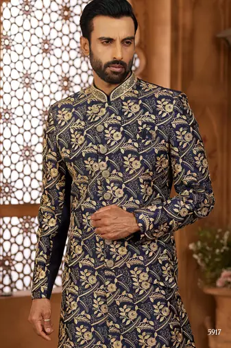 Navy blue indo-western sherwani set with full computer embroidery, coloured buttons, and thread, lace, and stone work.