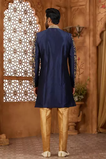 Navy blue indo-western sherwani set with full computer embroidery, coloured buttons, and thread, lace, and stone work.
