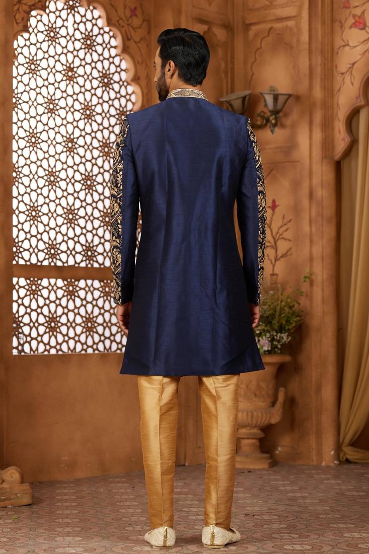 Navy blue indo-western sherwani set with full computer embroidery, coloured buttons, and thread, lace, and stone work.