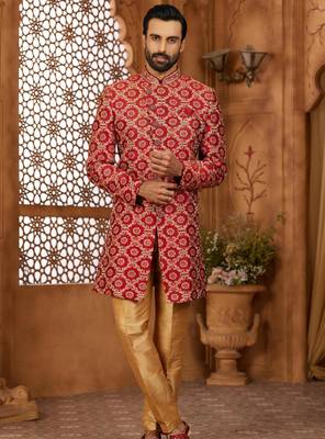 Maroon indo-western sherwani set with full computer embroidery, coloured buttons, and thread, lace, and stone work. 1