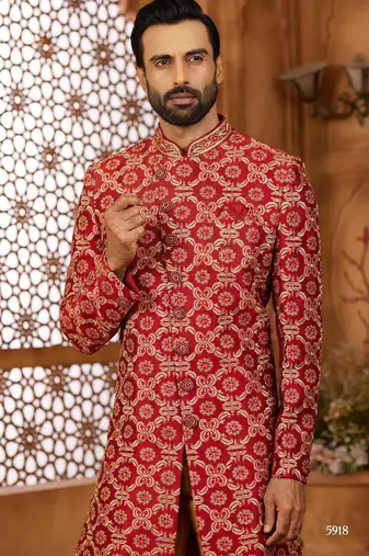 Maroon indo-western sherwani set with full computer embroidery, coloured buttons, and thread, lace, and stone work.