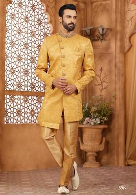 Gold indo-western sherwani set with full computer embroidery, coloured buttons, and thread, lace, and stone work. 1