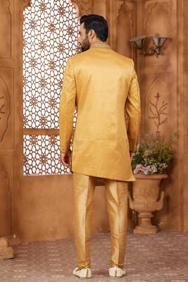 Gold indo-western sherwani set with full computer embroidery, coloured buttons, and thread, lace, and stone work. 3