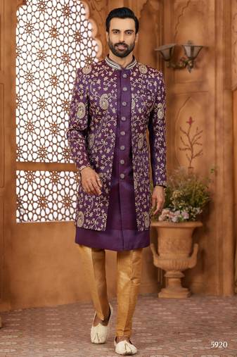 Purple indo-western sherwani set with full computer embroidery, coloured buttons, and thread, lace, and stone work.