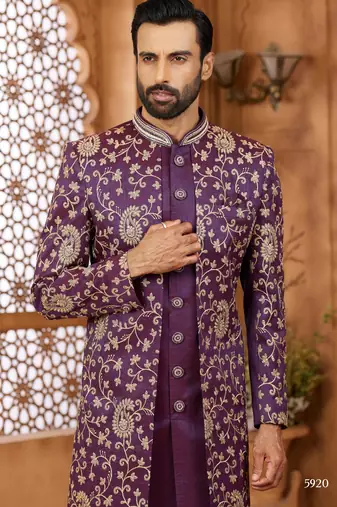 Purple indo-western sherwani set with full computer embroidery, coloured buttons, and thread, lace, and stone work.