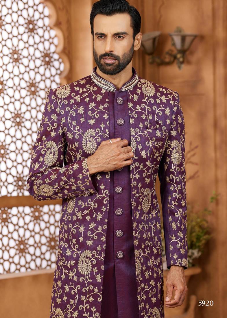 Purple indo-western sherwani set with full computer embroidery, coloured buttons, and thread, lace, and stone work.