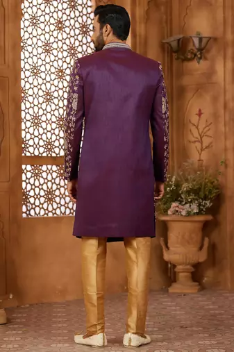 Purple indo-western sherwani set with full computer embroidery, coloured buttons, and thread, lace, and stone work.