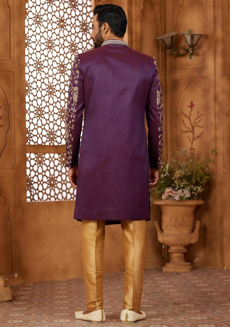 Purple indo-western sherwani set with full computer embroidery, coloured buttons, and thread, lace, and stone work.