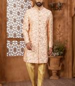 Peach indo-western sherwani set with full computer embroidery, coloured buttons, and thread, lace, and stone work.