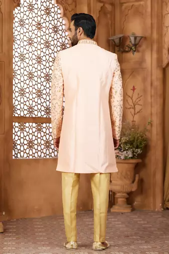 Peach indo-western sherwani set with full computer embroidery, coloured buttons, and thread, lace, and stone work.
