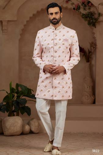Light pink indo-western sherwani set with full computer embroidery, coloured buttons, and thread, lace, and stone work.