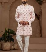 Light pink indo-western sherwani set with full computer embroidery, coloured buttons, and thread, lace, and stone work.