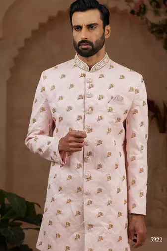 Light pink indo-western sherwani set with full computer embroidery, coloured buttons, and thread, lace, and stone work.