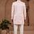 Light pink indo-western sherwani set with full computer embroidery, coloured buttons, and thread, lace, and stone work.