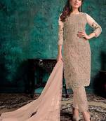 Beige embroidered net pant style salwar suit