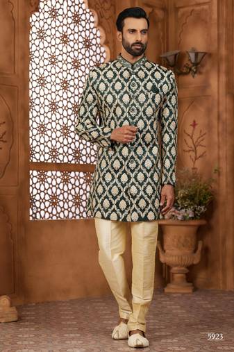 Green indo-western sherwani set with full computer embroidery, coloured buttons, and thread, lace, and stone work.