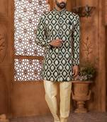 Green indo-western sherwani set with full computer embroidery, coloured buttons, and thread, lace, and stone work.