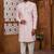Peach classic indo-western sherwani set with handwork on the neck & buttons,resham thread, stone & beads work.