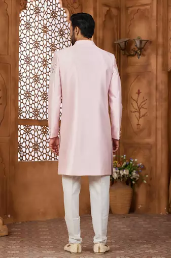 Peach classic indo-western sherwani set with handwork on the neck & buttons,resham thread, stone & beads work.