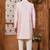 Peach classic indo-western sherwani set with handwork on the neck & buttons,resham thread, stone & beads work.
