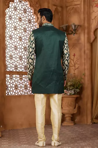 Green indo-western sherwani set with full computer embroidery, coloured buttons, and thread, lace, and stone work.