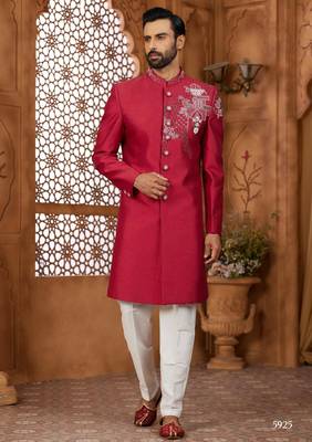 Red indo-western sherwani set with full computer embroidery, coloured buttons, and thread, lace, and stone work. 1
