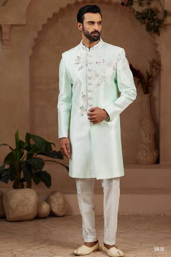 Mint green classic indo-western sherwani set with handwork on neck & buttons,resham thread, stone & beads work.
