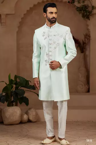 Mint green classic indo-western sherwani set with handwork on neck & buttons,resham thread, stone & beads work.