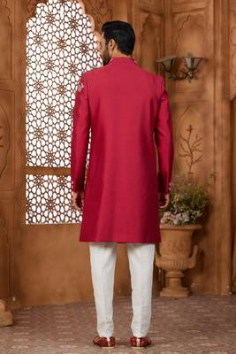 Red indo-western sherwani set with full computer embroidery, coloured buttons, and thread, lace, and stone work. 3