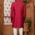 Red indo-western sherwani set with full computer embroidery, coloured buttons, and thread, lace, and stone work.