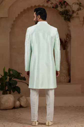 Mint green classic indo-western sherwani set with handwork on neck & buttons,resham thread, stone & beads work.