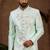 Mint green classic indo-western sherwani set with handwork on neck & buttons,resham thread, stone & beads work.